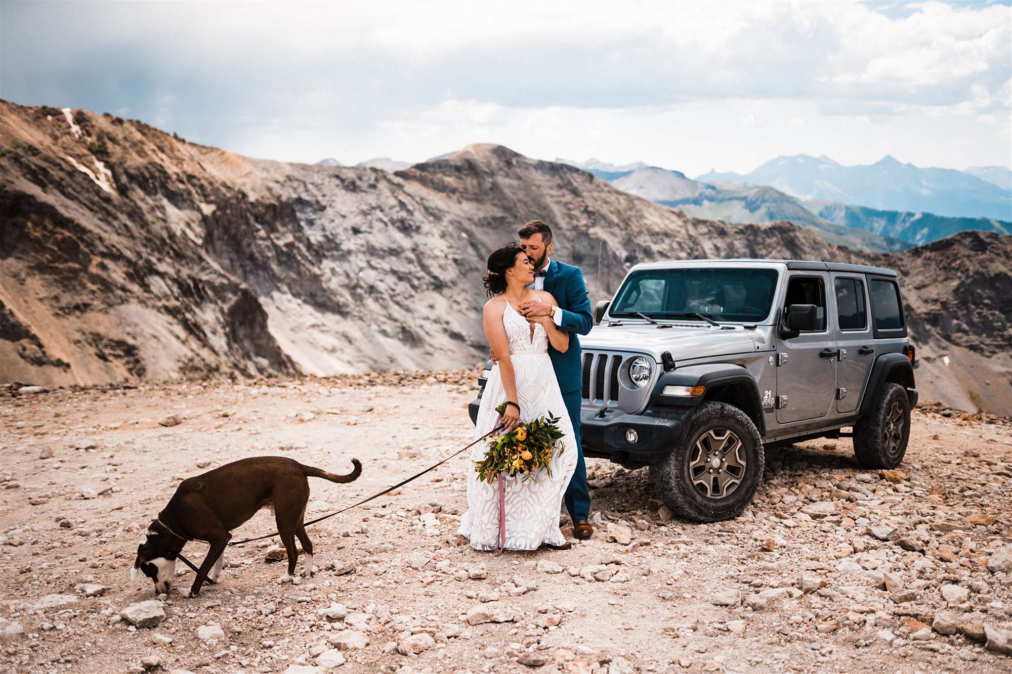 Telluride elopement couple standing by jeep with dog